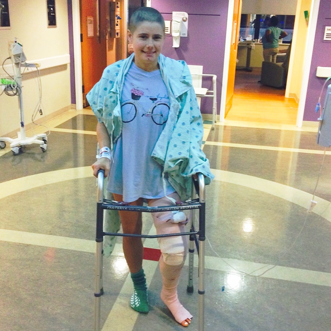 Samantha Stacy in a clinic with a walker and leg cast