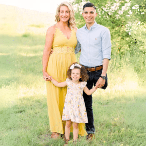 Carlos Garcia (right), a two-time osteosarcoma survivor, is pictured with his wife and their daughter, Mia