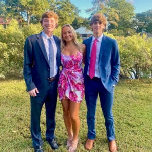 Sam Shumadine posing with friends before senior prom