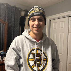 Gavin in a sweatshirt and beanie
